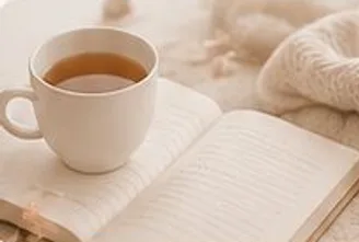 A warm cup on an open book